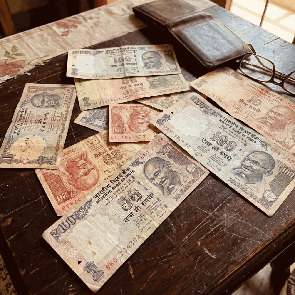 Old Indian currency notes showing purchasing power decline