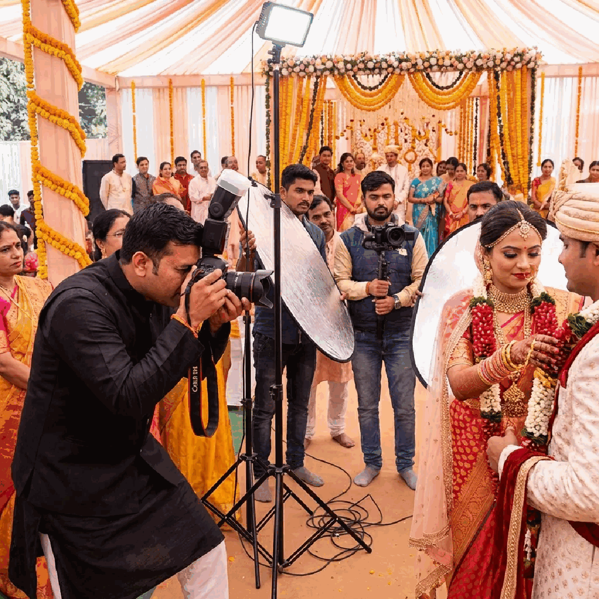 Photographer capturing moments at an Indian celebration